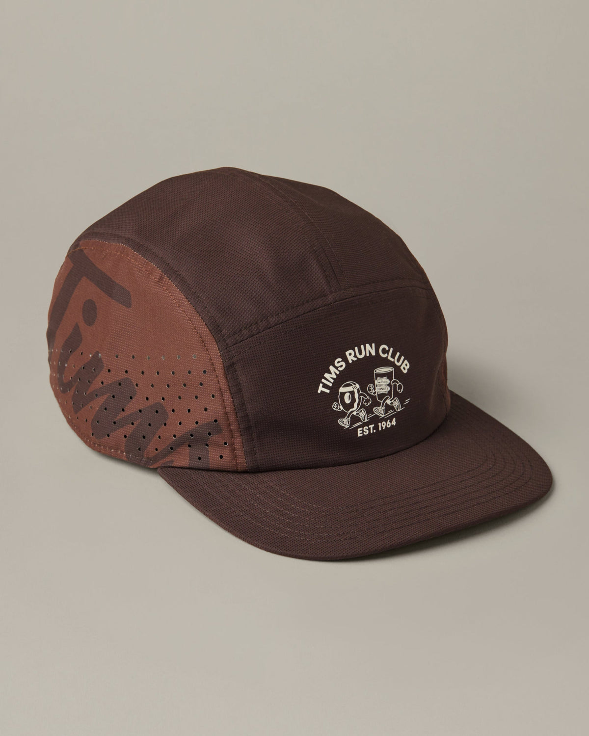 Espresso-brown adidas® trainer hat with perforated side panels and a cream Tims Run Club graphic on the front. - Image #2