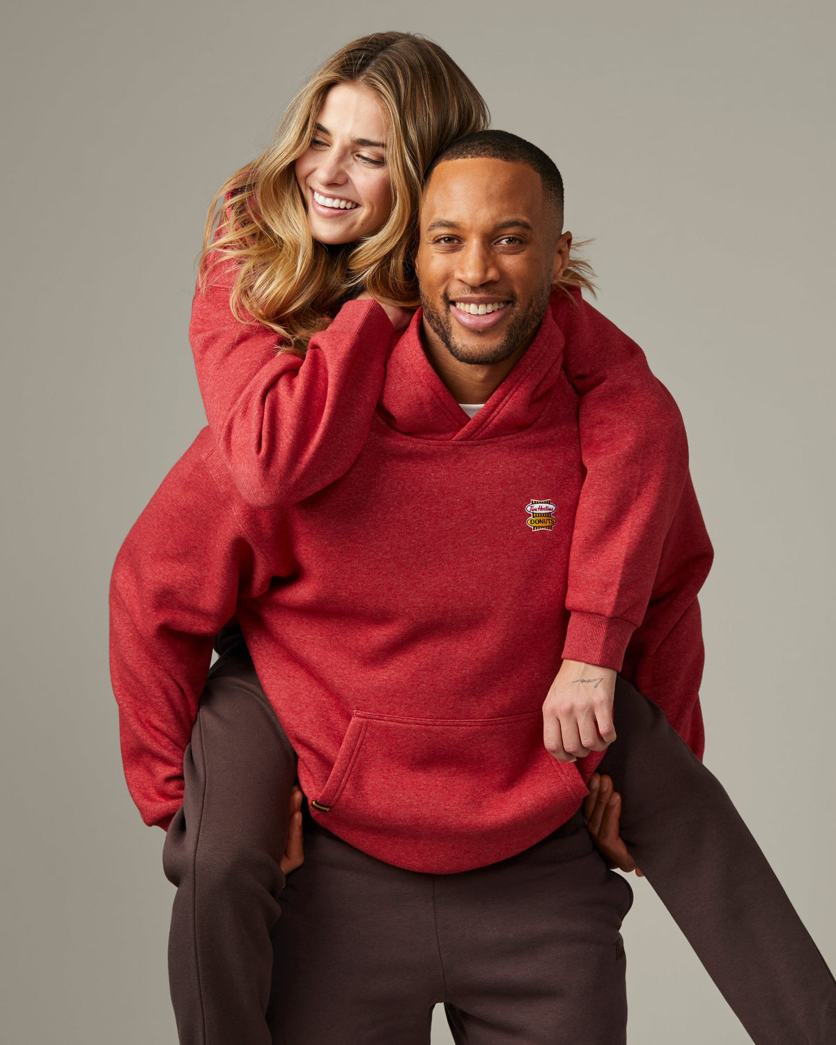 Red marl unisex hoodie featuring retro Tim Hortons logo on chest | Chandail à capuchon unisexe rouge chiné avec logo Tim Hortons rétro à l’avant. - Image #1