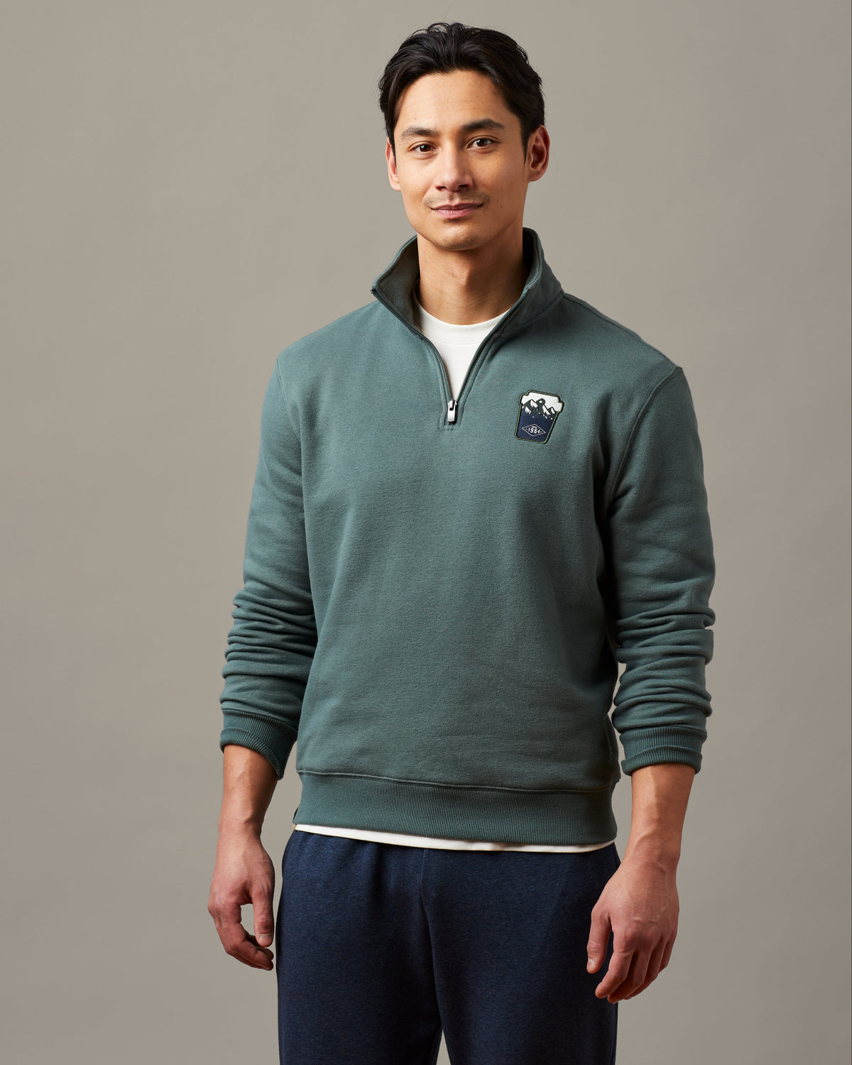 Forest green unisex quarter zip featuring embroidered Tims cup design | Chandail à glissière 1/4 unisexe vert forêt avec motif brodé représentant un gobelet Tim Hortons. - Image #2