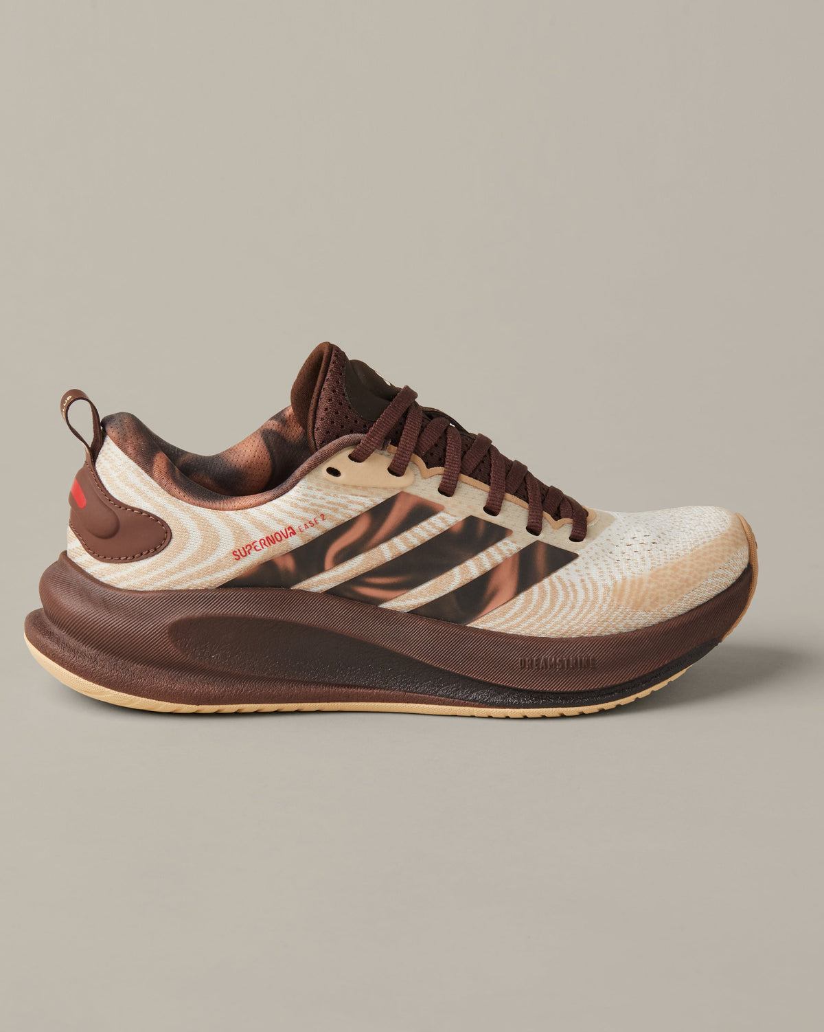 Women’s adidas® Supernova Ease running shoes in cream and coffee-brown shades with patterned 3-Stripes and Tim Hortons details. - Image #4