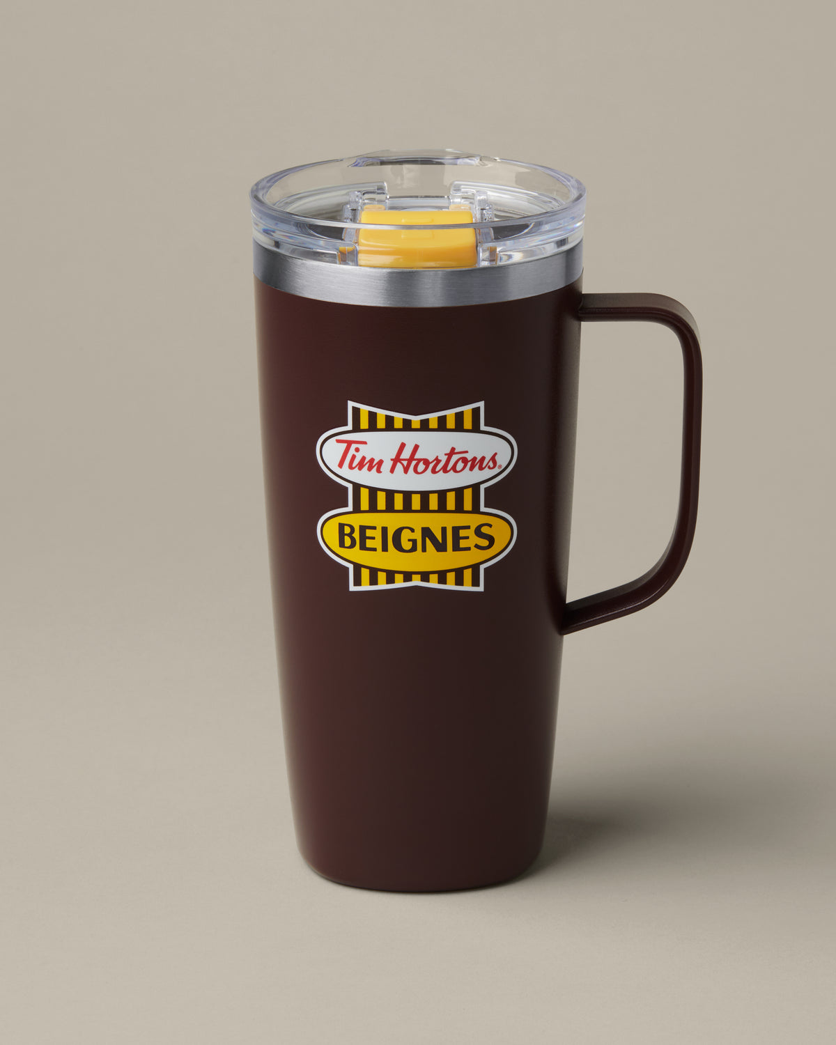20oz stainless steel Tim Hortons travel mug, insulated design for hot and cold drinks | Tasse de voyage en acier inoxydable de 20 oz Tim Hortons avec logo rétro en anglais, conception isotherme pour boissons chaudes et froides. - Image #1