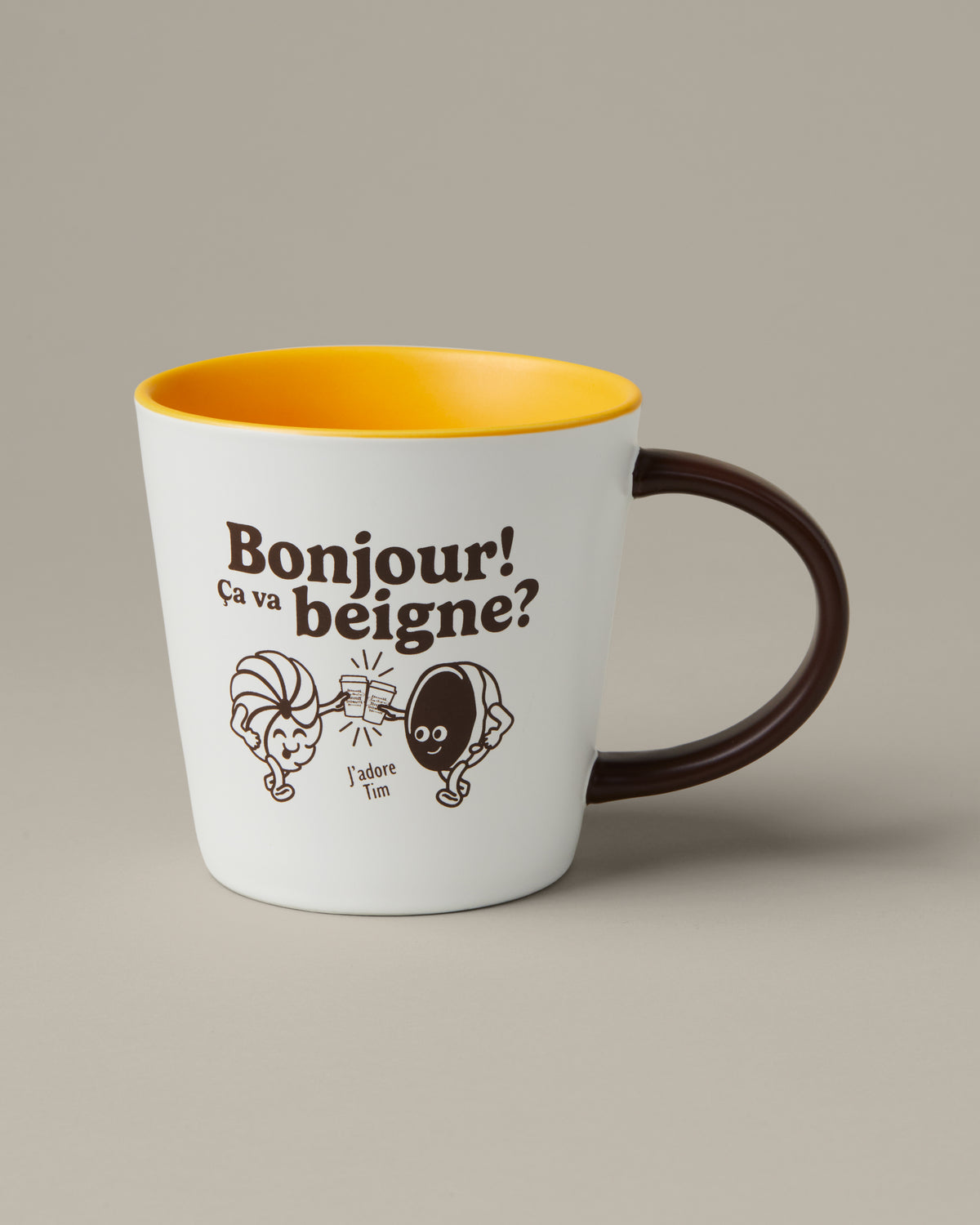 16oz retro ceramic mug with “Bonjour Ça va beigne” phrase and Tim Hortons branding | Tasse de porcelaine rétro de 16 oz avec phrase « Bonjour! Ça va beigne? » et marque Tim Hortons. - Image #1