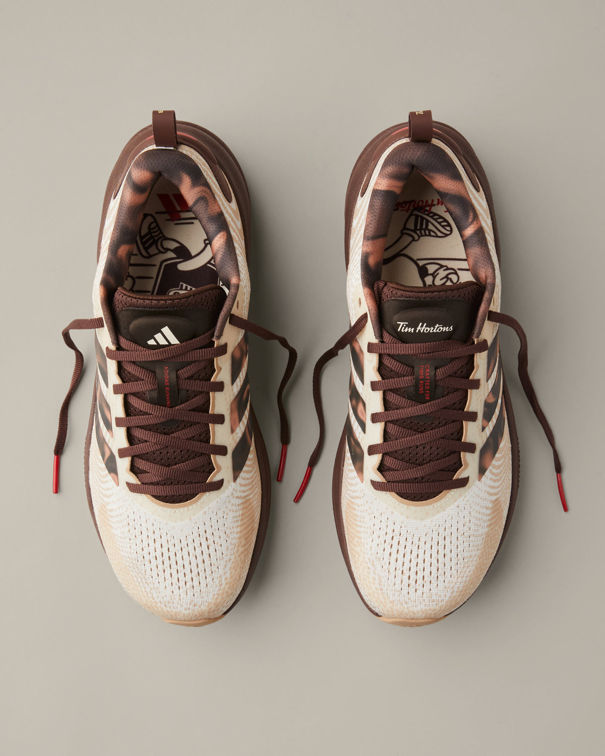 Women’s adidas® Supernova Ease running shoes in cream and coffee-brown shades with patterned 3-Stripes and Tim Hortons details. - Image #6