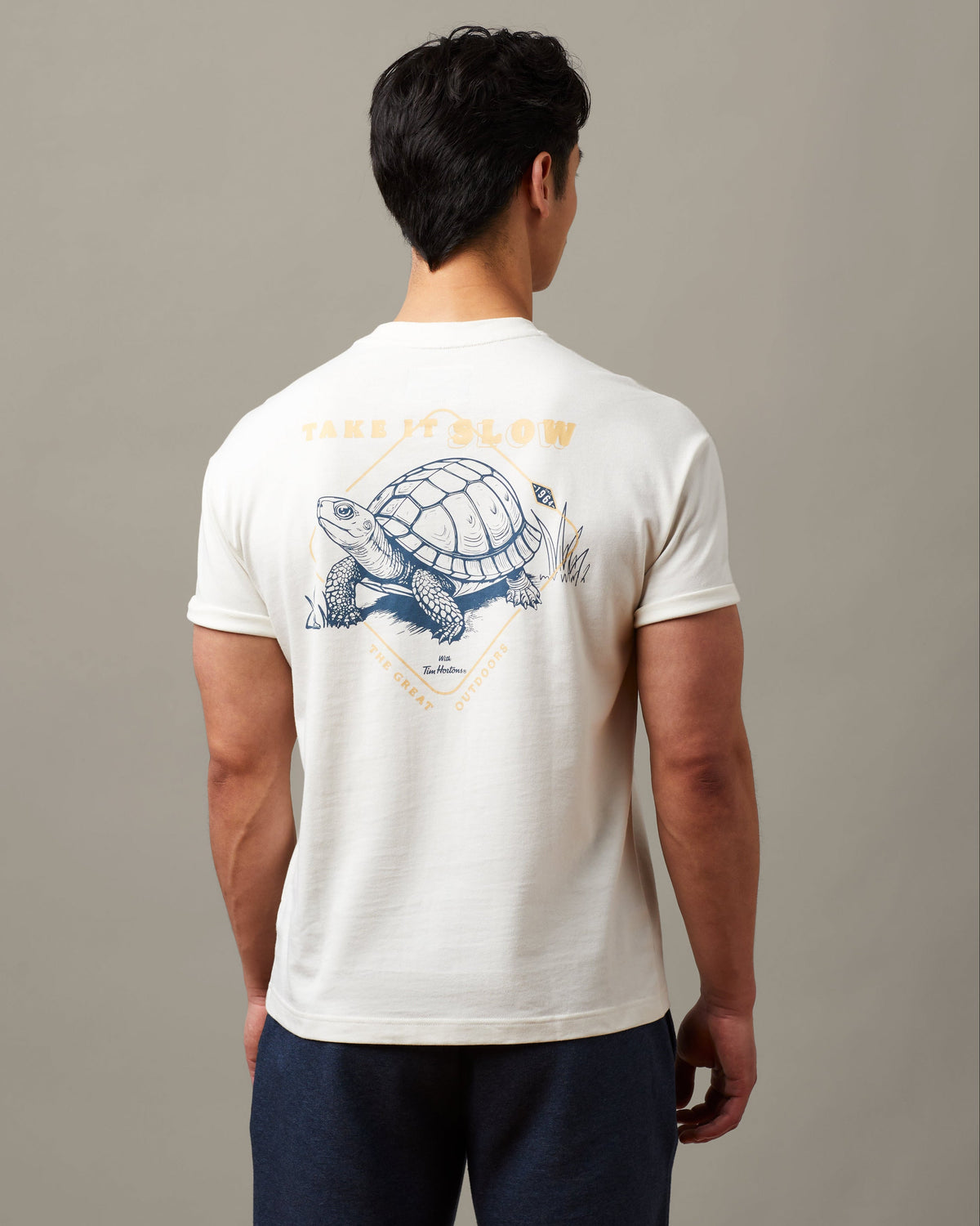 Natural unisex t-shirt featuring Take it Slow Tim Hortons graphic | T-shirt unisexe couleur naturelle « Take it Slow »  de Tim Hortons. - Image #1